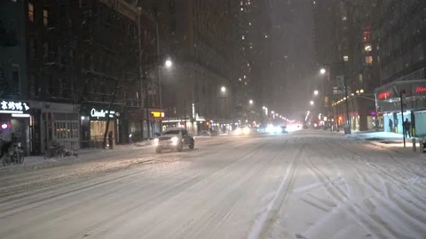 Cars Driving thru Midtown Streets During 2020 Nor'easter Stock Footage