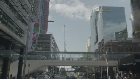 Cars Driving Under Elevated Walkway in Sydney City with Modern Buildings Stock Footage 341689967