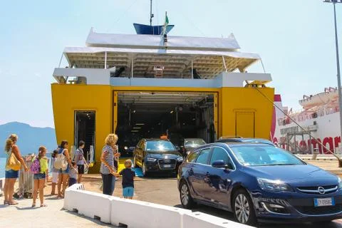 The cars leaves the cargo part of the ferry ship in Portoferraio port, Italy Stock Photos