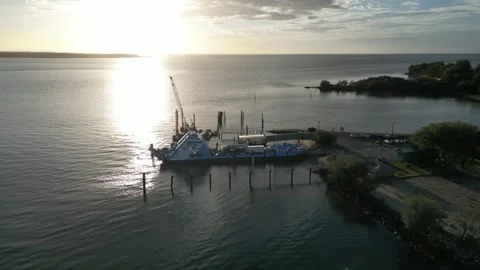 Cars loading on to Vehicle Ferry at sunset lower Stock Footage 281145656