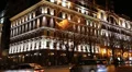 Cars near building with night illumination HD Footage