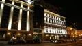 Cars near building with night illumination in Kiev, Ukraine HD Footage