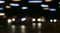 Cars in night city, defocused and with stereo sound HD Footage