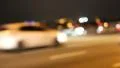 Cars in night city, defocused and with stereo sound HD Footage