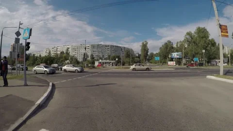 Cars pass the intersection of the road Stock Footage 131089404