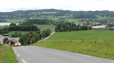 Cars pass by rural road in Straumen, Norway. Stock Footage 59571387