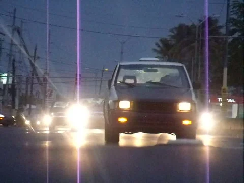 Cars Passing by at  Dusk with Thunderstorms Stock Footage 218274373