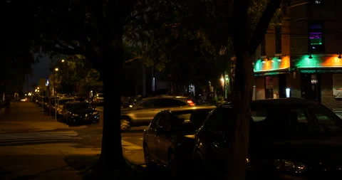 CARS PASSING AT INTERSECTION AT NIGHT Stock Footage 131130222
