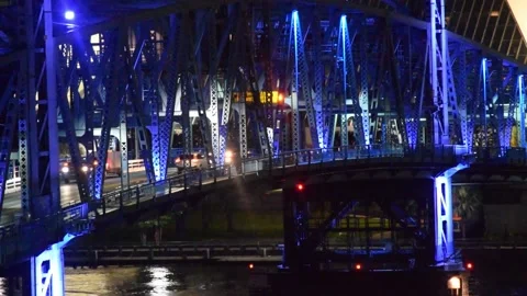 CARS PASSING OVER THE JACKSONVILLE DRAW BRIDGE AT NIGHT- JACKSONVILLE FL. Stock Footage