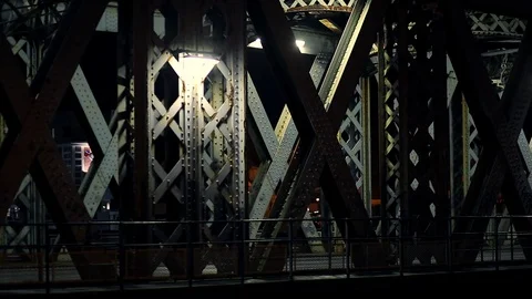 Cars passing through the illuminated tunnel of the city bridge Stock Footage