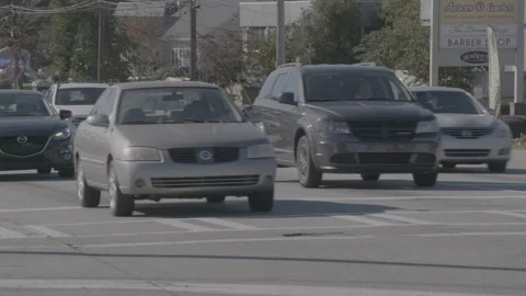 Cars Passing through Intersection 4K Stock Footage 148177239