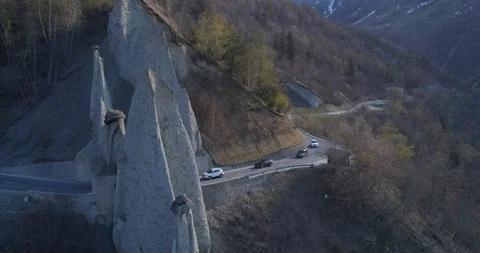 Cars passing under Euseigne pyramids - Aerial 4K Stock Footage 106230183