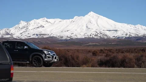 Cars passing by volcano Stock Footage 140549657