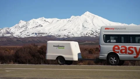Cars passing by volcano Stock Footage 140549669