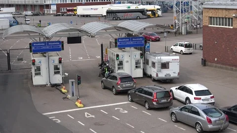 Cars queue at a checkpoint passenger port. Helsinki, Finland Stock Footage 76983651