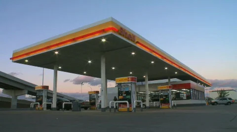 Cars refuel at a gas station Stock Footage