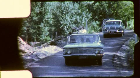 CARS Round Driving the Bend on Road 1960s Vintage Retro Film Home Movie 5577 Stock Footage