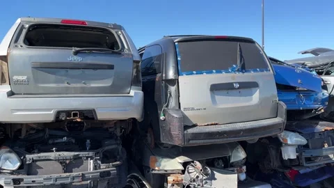 Cars In Scrap Yard Getting Crushed for Recycling Stock Footage 240781553