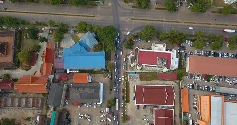Cars start driving on an intersection below in Vientiane, Laos Stock Footage 108469609