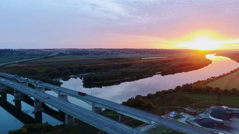 Cars traffic on highway bridge at sunset. Aerial view. Stock Footage