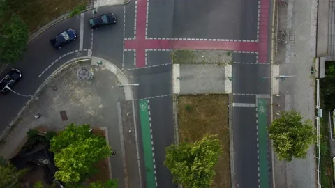 Cars turn left at an intersection on a road
Daring aerial view flight Video stock 201258633