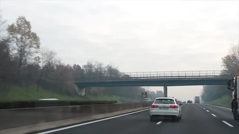 Cars vehicles driving on highway early morning late evening shot from vehicle Stock Footage 252148341