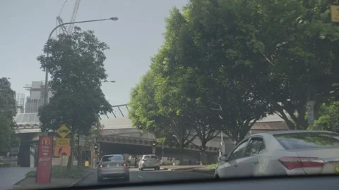 Cars Wait at City Intersection Under Overpass in Sydney, New South Wales, Austra Stock Footage 341687634