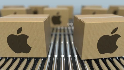 Carton boxes with Apple Inc logo move on roller conveyor. Conceptual editorial Video stock 109337721