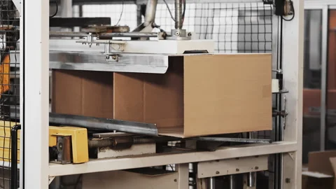 Carton boxes transported on the production conveyor line. Machinery mechanism Stock Footage 273340896