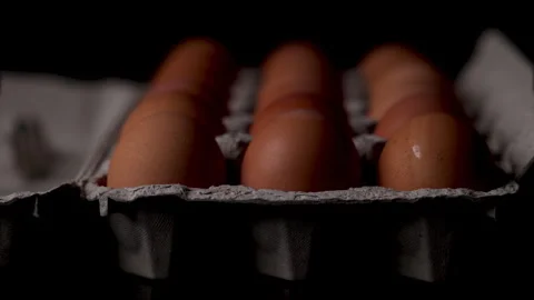 Carton of brown eggs high cost of food for basic living. Video stock 303166148