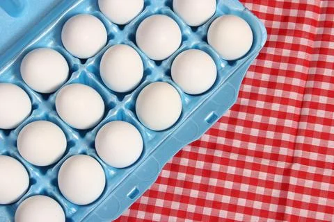 Carton of Eggs on Rustic Table With Checkered Table Cloth Stock Photos