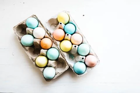 Carton of painted eggs ready for Easter. flat lay ecological concept Stock Photos
