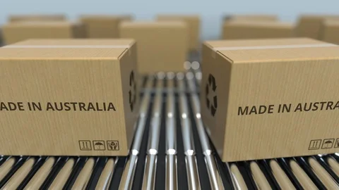 Cartons with MADE IN AUSTRALIA text on roller conveyor. Australian goods related Video stock 108987470