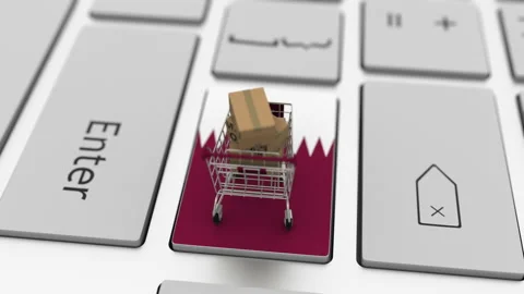 Cartons with MADE IN QATAR text and shopping cart on the computer keyboard Stock Footage 146460412