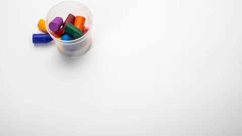 Cartoon about a set of colored wax fines on an white background Stock Footage 124600940