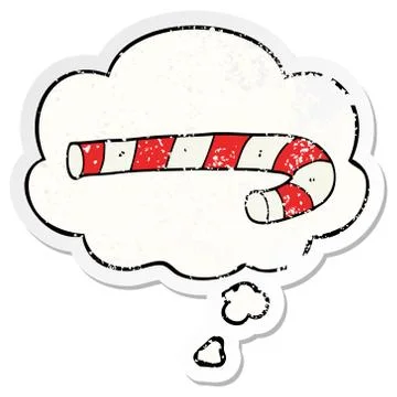 Cartoon candy cane and thought bubble as a distressed worn sticker Stock Illustration