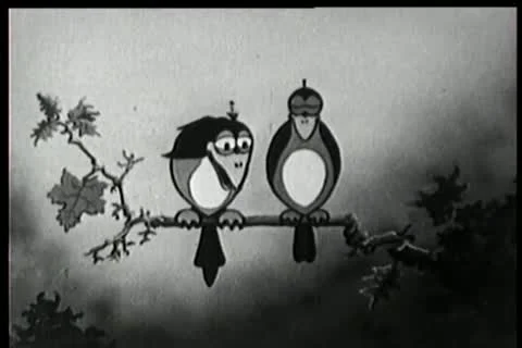 Cartoon of cupid shooting arrow at two birds on branch Stock Footage