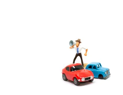 Cartoon doll standing shouting using a megaphone. Stock Photos