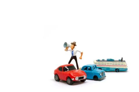 Cartoon doll standing shouting using a megaphone. Stock Photos