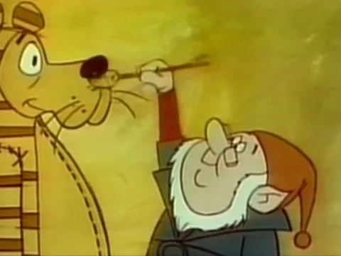 Cartoon of elf pulling string on toy lion to make it roar, 1970s 動画素材 64820301