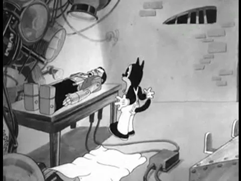 A cartoon Frankenstein is aroused by an electric shock and eats a movie camera Stock Footage 75304760