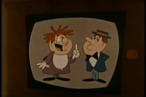 Cartoon of person's hand turning on a TV set Stock Footage 11347866