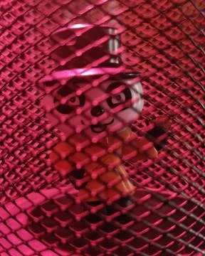 A cartoon under a cage. Stock Photos