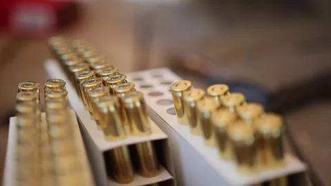 Cartridges in a plastic box. Bullet storage box Stockbeeldmateriaal 334492252