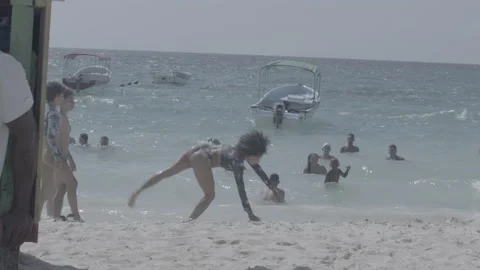 Cartwheel on the beach Stock Footage 233799437