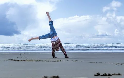 Cartwheel on the beach. Stock Photos