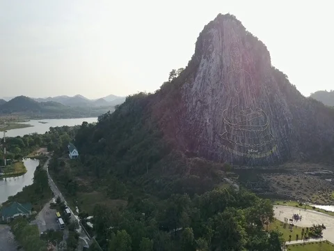 Carved buddha image from gold on the cliff at Khao Chee chan, Pattaya, Thailand 動画素材 77325601