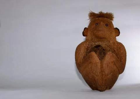 Carved coconut monkey Stock Photos