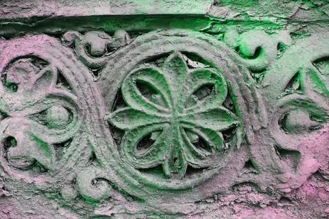 Carved pattern on the stone wall, old ornament fresco Stock Photos