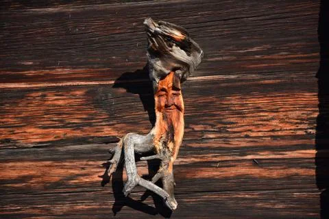Carved root with a face Stock Photos